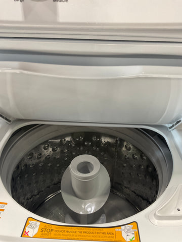 Dryer of model GUD27ESSMWW. Image # 2: GE Unitized Spacemaker® 3.8 cu. ft. Capacity Washer with Stainless Steel Basket and 5.9 cu. ft. Capacity Electric Dryer