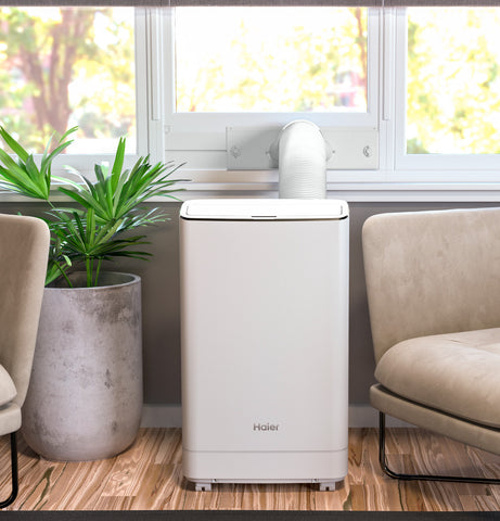 Room Air Conditioner of model QPCA14YZMW. Image # 3: Haier® Portable Air Conditioner with Dehumidifier for Large Rooms up to 550 sq. ft., 13.500 BTU (9,700 BTU SACC)